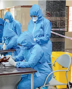  ??  ?? FIRST LINE OF DEFENCE Health workers take blood samples at a testing centre in Chennai