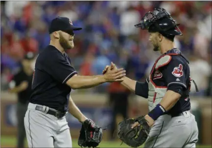  ?? LM OTERO — ASSOCIATED PRESS ?? Cody Allen, left, and Yan Gomes celebrate the final out ending an opening-day 8-5 win over the Rangers on April 3 in Arlington, Texas.