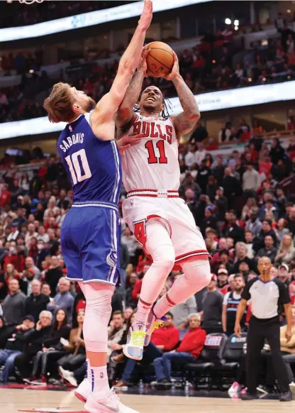  ?? GETTY IMAGES ?? Bulls forward DeMar DeRozan (shooting over the Kings’ Domantas Sabonis on Saturday) says he refuses to be drawn into the rumor mill.