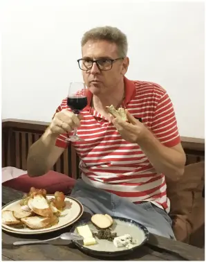  ??  ?? CHEF of the House Jean-Michel enjoys his wine and bread platter on a break.