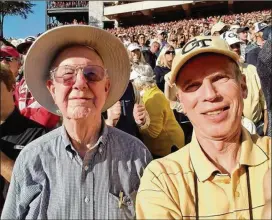  ?? CONTRIBUTE­D ?? Alumnus Bobby Joe Anderson (left, at the 2016 win at Georgia with son Stan Anderson, also a Tech graduate) has attended every Tech-UGA game since 1945.