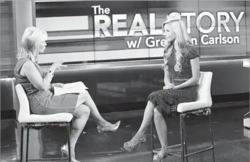  ?? Rob Kim Getty Images ?? GRETCHEN CARLSON, left, interviews Miss America Kira Kazantsev in 2014. The former Fox News anchor alleged in a lawsuit that Roger Ailes sabotaged her career in retaliatio­n for rebuffing his sexual advances.