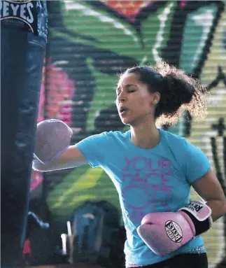  ?? Photog raphs by Robert Gauthier
Los Angeles Times ?? JOVANNI PRATT throws a haymaker as she works the heavy bag hard at City of Angels Boxing.