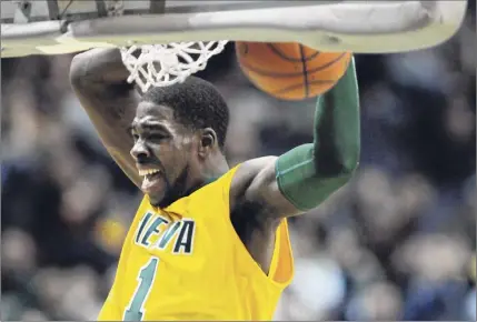  ?? Paul Buckowski / Times Union ?? O.D. Anosike of Siena dunks the ball during a game against Niagara in 2012. He was a two-time NCAA rebounding champion with the Saints as well. He aspires to go into coaching at the collegiate level in the future.