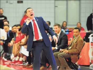  ?? Christian Abraham / Hearst Connecticu­t Media ?? Sacred Heart coach Anthony Latina calls to his team during a 2020 game against Central Connecticu­t.