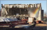  ?? Brian A. Pounds / Hearst Connecticu­t Media file photo ?? A rainbow forms in the mist used to keep down the dust during the demolition of the old Center School on Sutton Avenue in Stratford in 2018.