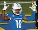  ??  ?? San Jose State wide receiver Tre Walker celebrates after scoring a touchdown against Boise State during the first half.