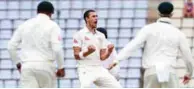  ?? – AFP ?? STRIKING EARLY: Mitchell Starc, centre, celebrates with teammates after he dismissed Kusal Perera just before stumps.