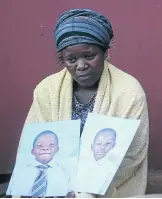  ?? / KABELO MOKOENA ?? Rivonia Motswi with pictures of her two children, who drowned in a dam yesterday.