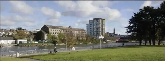  ??  ?? How the new skyline will look from St Dominick’s Park with the 10 storey tower block beside Donaghy’s Mill. Below, the site of the developmen­t