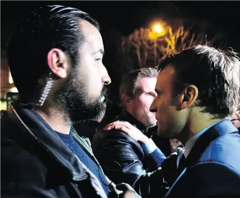  ?? JEAN-FRANCOIS MONIER / AFP / GETTY IMAGES FILES ?? Then-French presidenti­al election candidate Emmanuel Macron, right, and his head of security Alexandre Benalla are seen in 2017. Benalla has remained at his post despite roughing up a protester in May.
