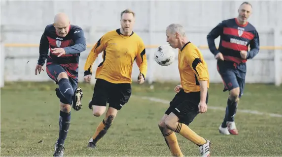  ??  ?? Over 40s football between Boldon Colliery Old Barrel (navy red) and Ivy Legends, played at Boldon CA Sports Ground.