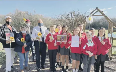  ?? ?? Andrew Griffith at the Arundel Bee Project garden opening last year with Arundel CE Primary