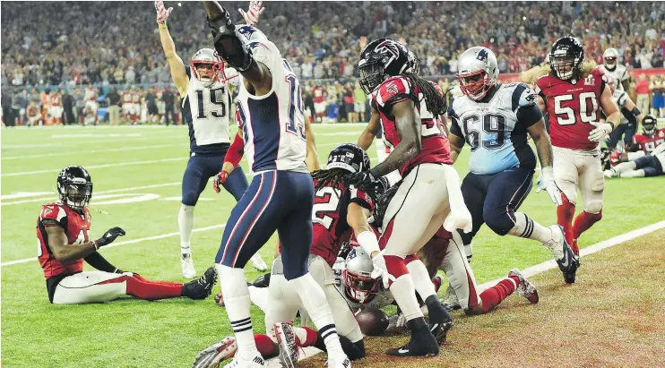  ?? AFP/GETTY IMAGES ?? James White of the Patriots scores the game winning touchdown in overtime against the Falcons during Super Bowl LI at NRG Stadium on Sunday.