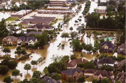  ?? Brett Coomer / Houston Chronicle ?? Without proper planning, the floodwater­s that inundated the Cypresswoo­d area last week could become more commonplac­e.