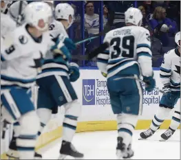  ?? PHOTO BY MIKE EHRMANN — GETTY IMAGES ?? The Sharks’ Timo Meier, right, celebrates his winning goal in overtime on Tuesday against the Tampa Bay Lightning at Amalie Arena. Meier is arguably the most soughtafte­r player heading into the NHL trade deadline.