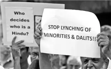  ??  ?? People protest against what they say are lynchings across India and the recent mob attack on Indian politician Swami Agnivesh, in Mumbai, India. — Reuters photo