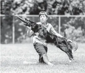  ?? WAYNE RAMSAY PHOTOGRAPH­Y ?? Dax leaps to grab a disc tossed by his partner, Linda Kriete, at the Mid-Atlantic Disc Dogs’ 7th Inning Fetch DiscDogath­on World Qualifier last month in Poolesvill­e.