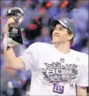  ?? By H. Darr Beiser, USA TODAY ?? New York titan: Super Bowl MVP Eli Manning savors his second Lombardi Trophy.