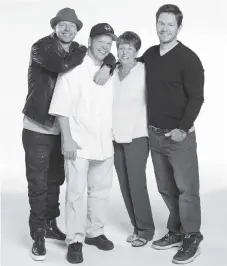  ?? PHOTO BY MATT HOYLE/A&E ?? Donnie, Paul, Alma and Mark Wahlberg, from left, star in “Wahlburger­s.” Brothers Paul, Mark and Donnie Wahlberg work together as their family restaurant becomes one of the fastest-growing chains in the world in a new episode airing tonight on A&E.