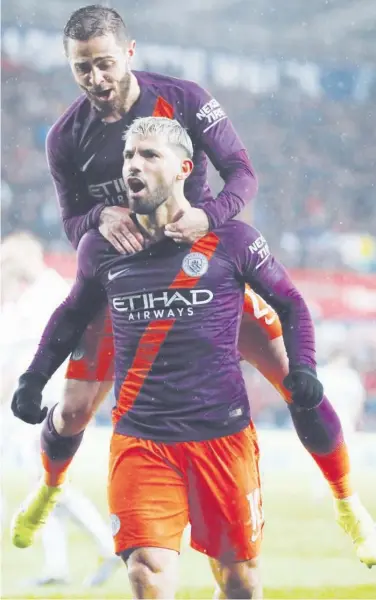  ?? Reuters ?? Manchester City’s Sergio Aguero celebrates with Bernardo Silva after scoring a goal against Swansea during their FA Cup match.