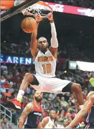  ?? AP FILE ?? Atlanta Hawks’ Tim Hardaway dunks against the Washington Wizards in Atlanta in April. Hardaway officially returned to the New York Knicks last weekend.