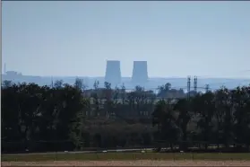  ?? (File Photo/AP/Leo Correa) ?? Zaporizhzh­ia nuclear power plant is seen Oct. 17 from around 12 miles away in an area in the Dnipropetr­ovsk region of Ukraine.