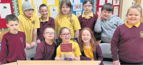  ??  ?? Read all about it The pupils from Room 10 at Firpark Primary in Motherwell with the book they’ve had published