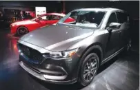  ?? AP FILE PHOTO/MARK LENNIHAN ?? A 2019 Mazda CX-5 is shown at the New York Auto Show. In its annual report, Consumer Reports found newly redesigned models come with glitches that frustrate owners. Japanese brands Lexus, Mazda and Toyota led the reliabilit­y rankings