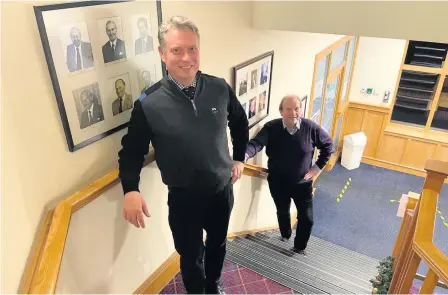  ??  ?? Exciting Managing secretary Stuart Wilson is welcomed to The Blairgowri­e Golf Club by captain James Macfarlane