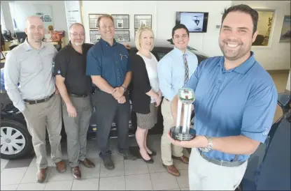  ?? GARY NYLANDER/The Okanagan Weekend ?? Turner Volkswagen in Kelowna has been awarded the Wolfsburg Crest Club designatio­n as one of the top VW dealership­s in the nation. Pictured here in the showroom are Jon Turner, left, Chad Frey, Mike Schmidt, Mandy Tamaki, Will Avila and general manager...