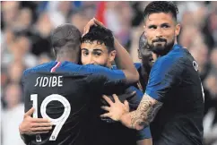  ??  ?? Easy night: Nabil Fekir is congratula­ted by Djibril Sidibe