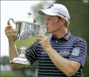  ?? CHUCK BURTON — THE ASSOCIATED PRESS FILE ?? In this file photo, Brandt Snedeker kisses the trophy after winning the Wyndham Championsh­ip golf tournament at Sedgefield Country Club in Greensboro, N.C. The PGA Tour’s final regular-season event begins Thursday.