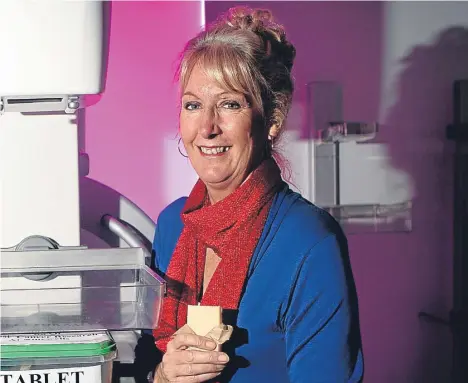  ??  ?? A MOUNTAIN of homemade tablet taller than Ben Nevis has helped a Dundee woman raise almost £60,000 for breast cancer research.Fiona Edwards has been selling her homemade tablet at running events and through friends and family around Tayside and Fife since 2003 to support breast cancer