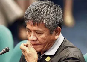  ?? — AP ?? Pensive moment: Matobato answering questions at the Philippine Senate in Manila.