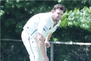  ??  ?? Michael Rabl bowls during the division three match against Neerim District.