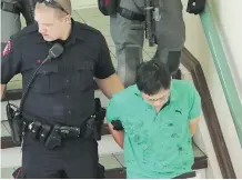  ?? FILES ?? Accused killer Jin Qing Huang, shown being escorted by police in June, will undergo further psychologi­cal testing, a judge has ruled.