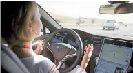  ?? REUTERS ?? A test driver demonstrat­es autopilot features in a Tesla Model S electric car in California, the US, in October last year.