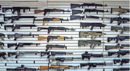  ??  ?? Last year, the ATF was asked to retrieve more guns sold to disqualifi­ed buyers than in any other year in the past decade. The sale of a rifle to one such buyer preceded its use in the Texas church shootings last month. ELAINE THOMPSON/AP