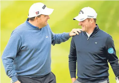  ??  ?? Anthony Wall of England and Marc Warren of Scotland share a joke. Picture: Getty,