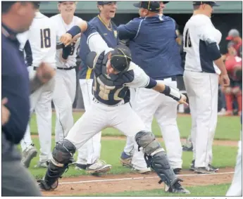  ?? Haley Nelson/Post-Gazette ?? Mars catcher Jack Anderson celebrates with his teammates after their 4-1 win against West Allegheny in a Class 5A semifinal Wednesday.