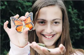  ?? PATRICK DOYLE ?? Genevieve Leroux, with a monarch caterpilla­r, has tagged 124 of the endangered butterflie­s.