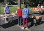  ?? TAWANA ROBERTS — THE NEWS-HERALD ?? Painesvill­e United Methodist Church Pastor Jan Yandell volunteers at the fall school market on Sept. 28. The market was held at Lake County Central YMCA in Painesvill­e.