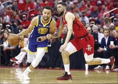  ??  ?? Curry (left) rives around Rivers during Game Six of the Western Conference Semifinals of the 2019 NBA Playoffs at Toyota Centre on in Houston. — AFP photo