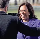  ?? JONATHAN ERNST/POOL/AFP VIA GETTY IMAGES ?? Kamala Harris hugs her husband, Doug Emhoff, after being sworn in as vice president Wednesday at the U.S. Capitol.