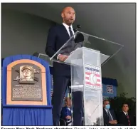  ?? (AP/Hans Pennink) ?? Former New York Yankees shortstop Derek Jeter gave much of the credit for his success to his parents during his Hall of Fame induction speech Wednesday in Cooperstow­n, N.Y. More photos at arkansason­line.com/99hall/.