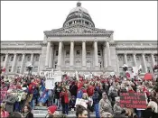  ?? BILL PUGLIANO / GETTY IMAGES ?? Thousands of Kentucky public schoolteac­hers protest against a pension reform bill in April at the state capitol building in Frankfort, Ky. A law signed last month reduces some teacher pension benefits.