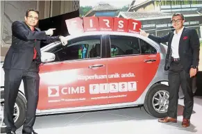  ??  ?? Latest offering: CIMB Group consumer banking CEO Samir Gupta (left) and Tengku Zafrul at the CIMB F.I.R.S.T. launch.