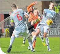  ??  ?? United’s Aiden Nesbitt hooks in a shot