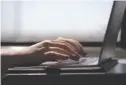  ?? AP PHOTO/JENNY KANE ?? A woman types on a laptop in 2021 while on a train in New Jersey.